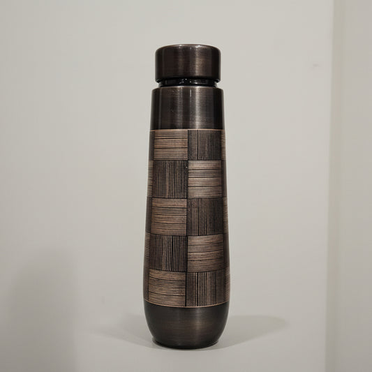 Bronze-colored cylindrical object on a white background