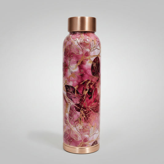 Glass water bottle with floral design and rose gold accents on a tiled wall background