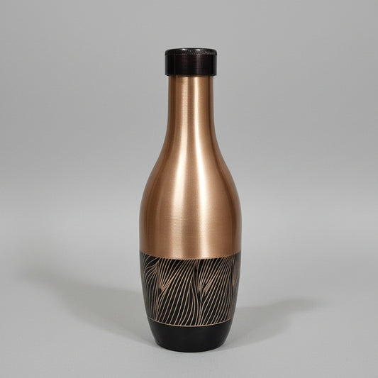 Bronze-colored hair dryer on a tiled bathroom floor