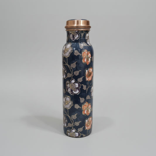 Decorative water bottle with floral design on a tiled floor