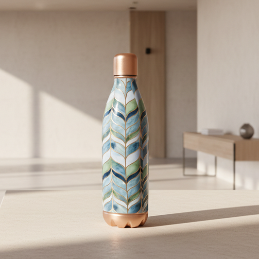 Decorative bottle with blue and green mosaic design on a tiled wall background