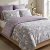 Floral patterned bedding set on a bed in a bedroom setting